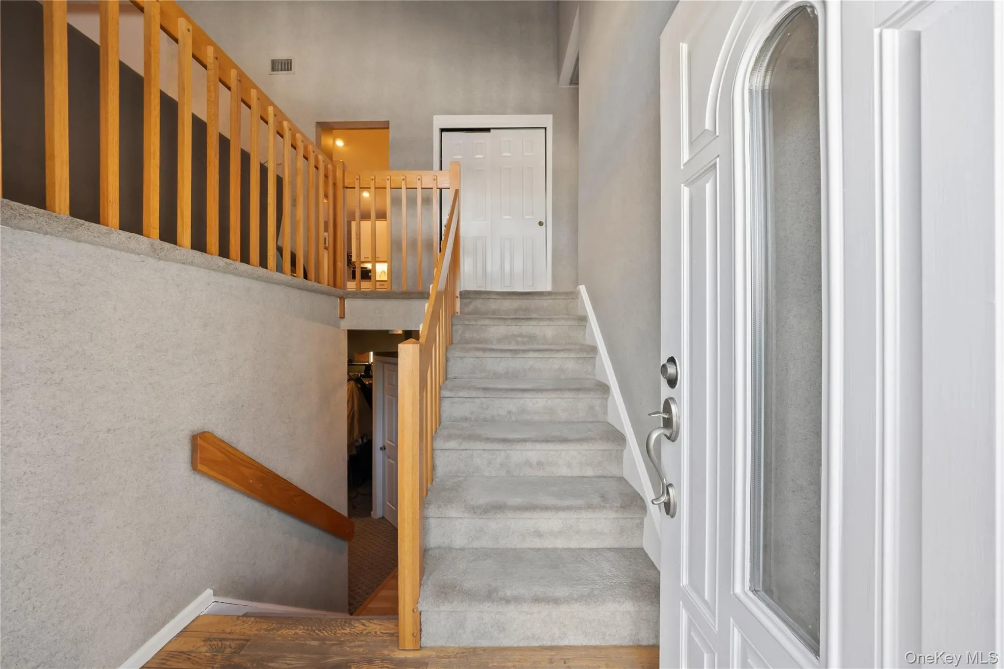 Stairs with baseboards and wood finished floors Stairs with baseboards and wood finished floors