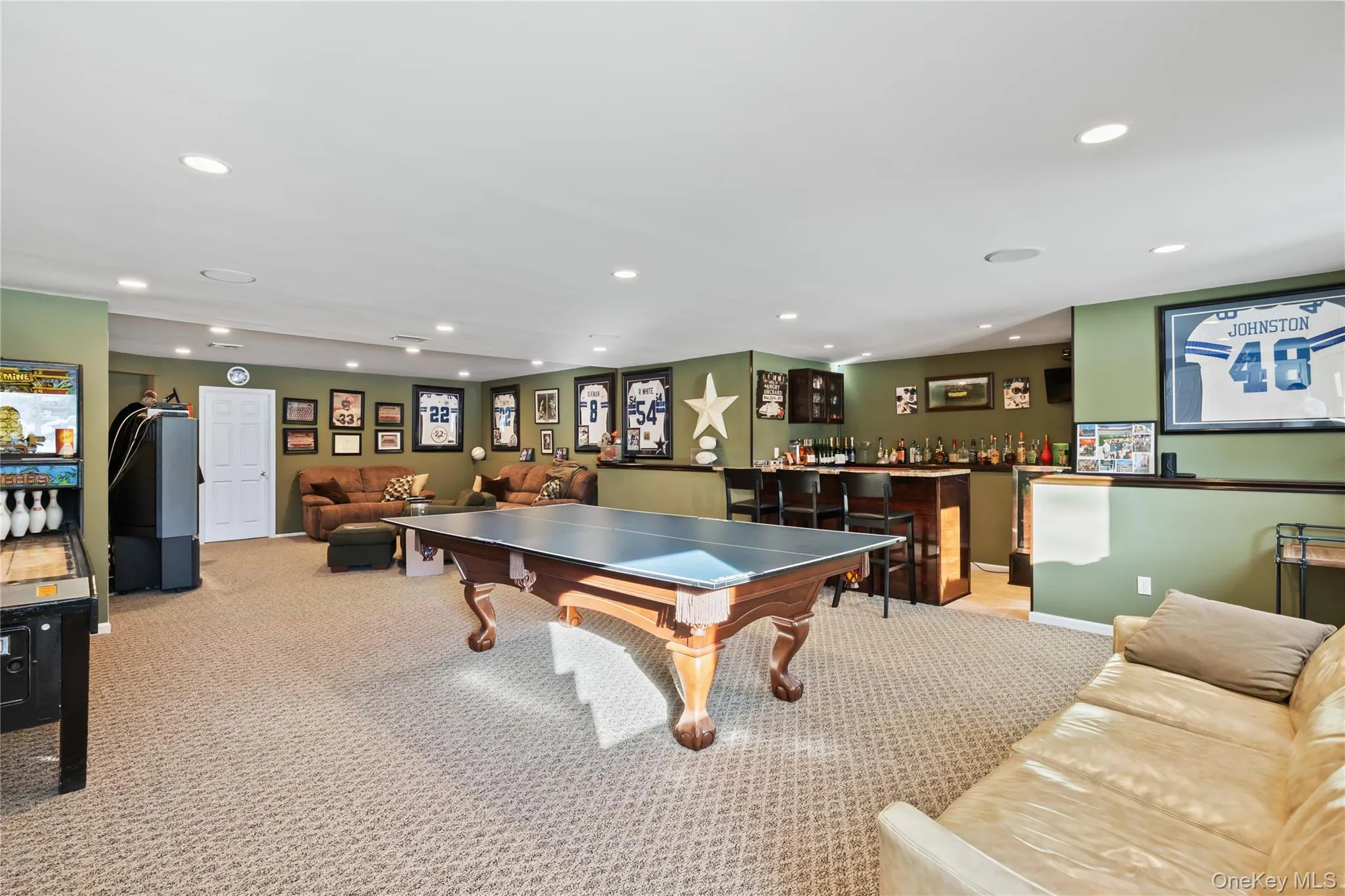 Game room featuring a bar and recessed lighting Game room featuring a bar and recessed lighting