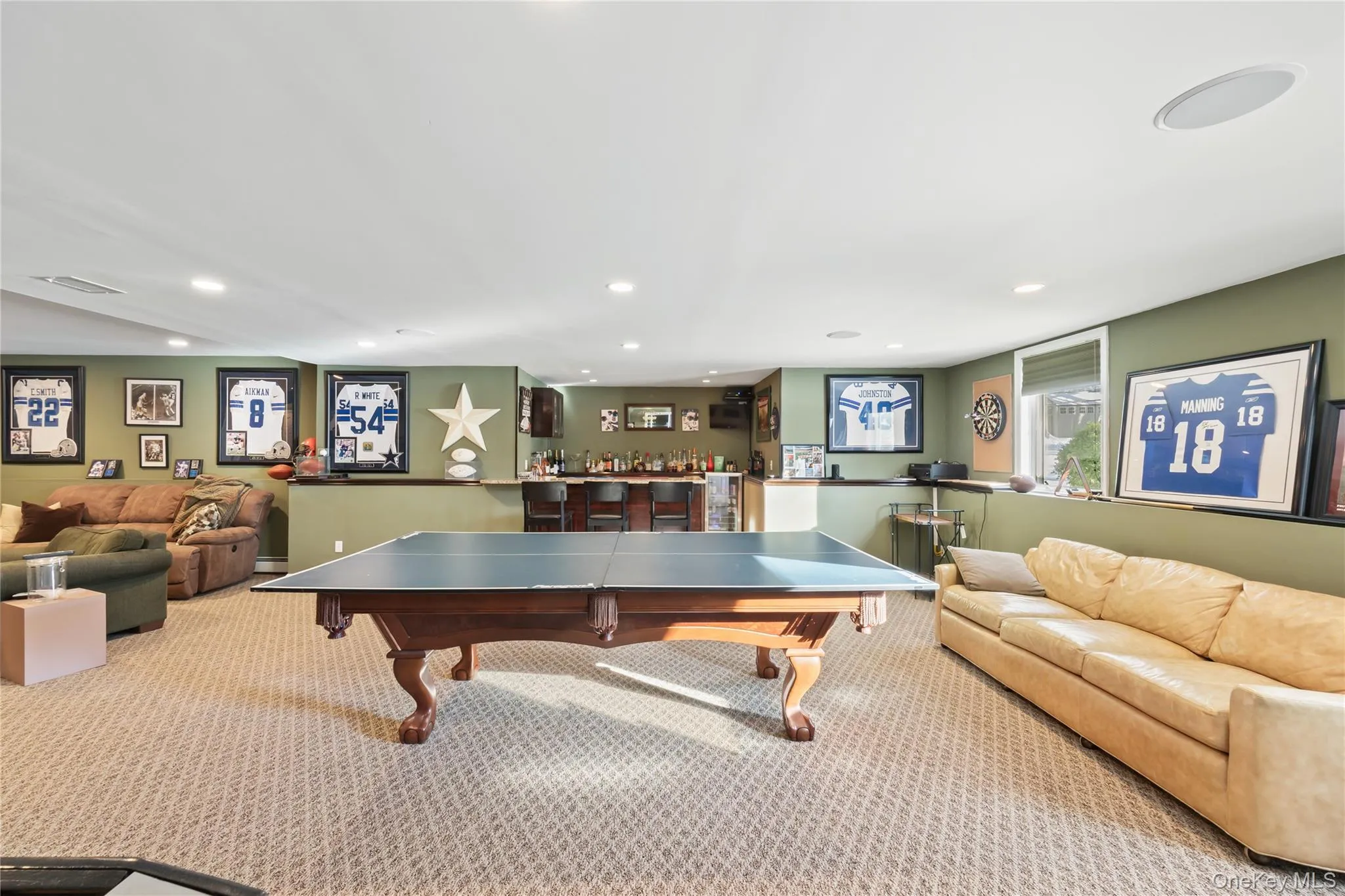 Rec room with a dry bar and recessed lighting Rec room with a dry bar and recessed lighting