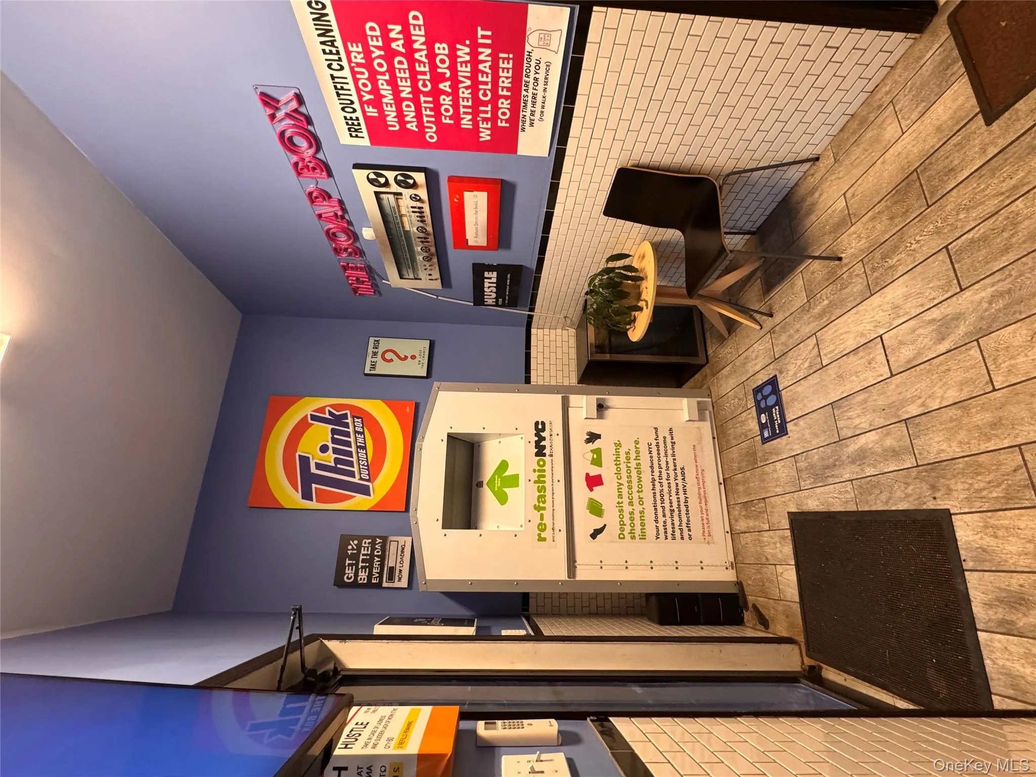 Welcome area featuring wainscoting and brick wall Welcome area featuring wainscoting and brick wall