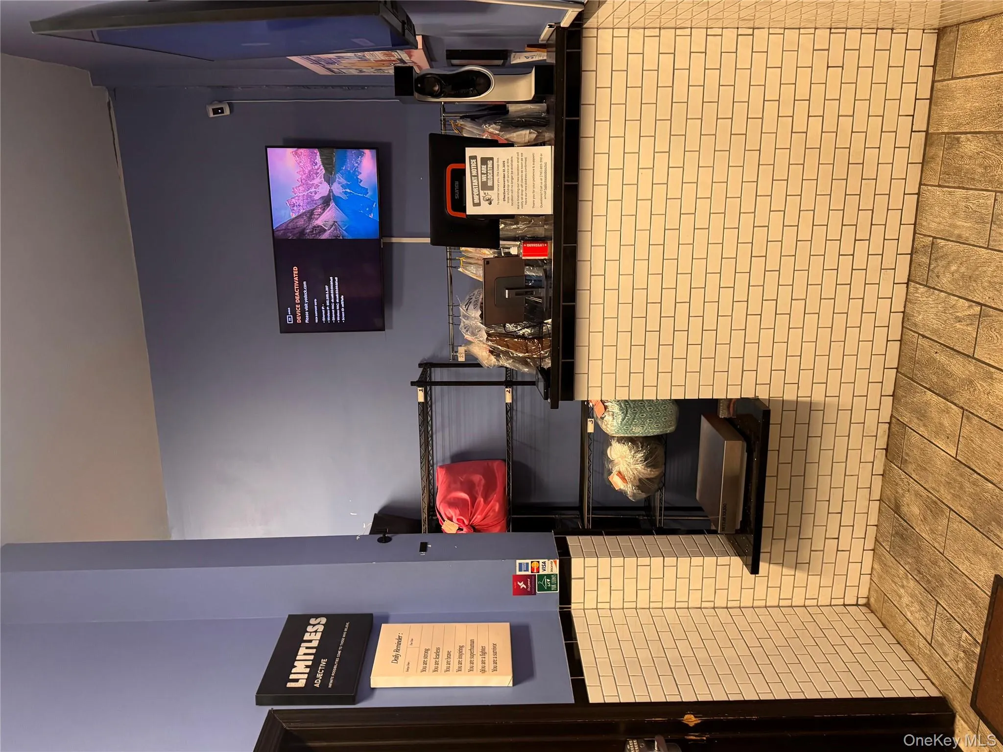 Reception area with a wainscoted wall and tile walls Reception area with a wainscoted wall and tile walls