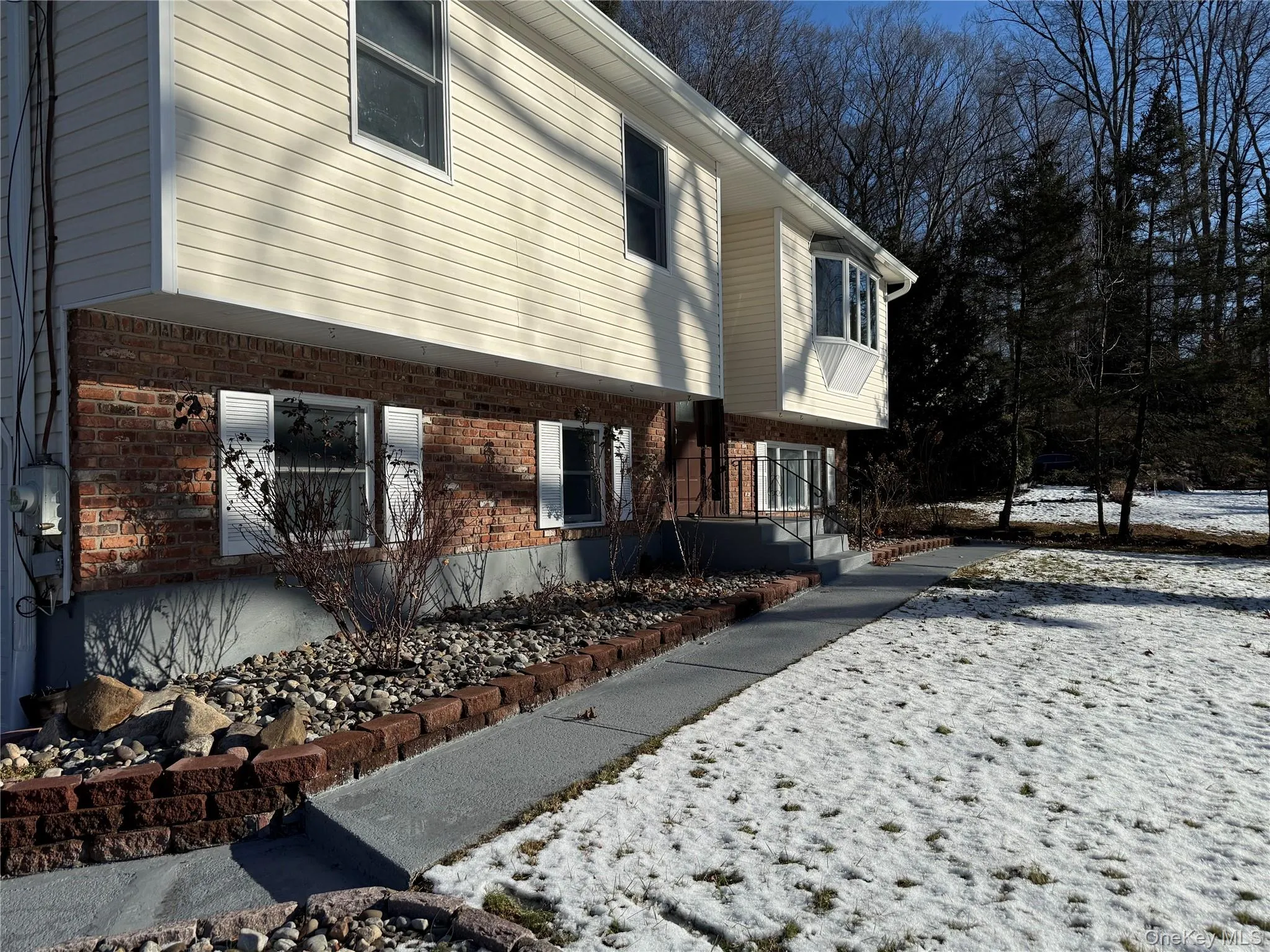 View of home's exterior featuring brick siding View of home's exterior featuring brick siding