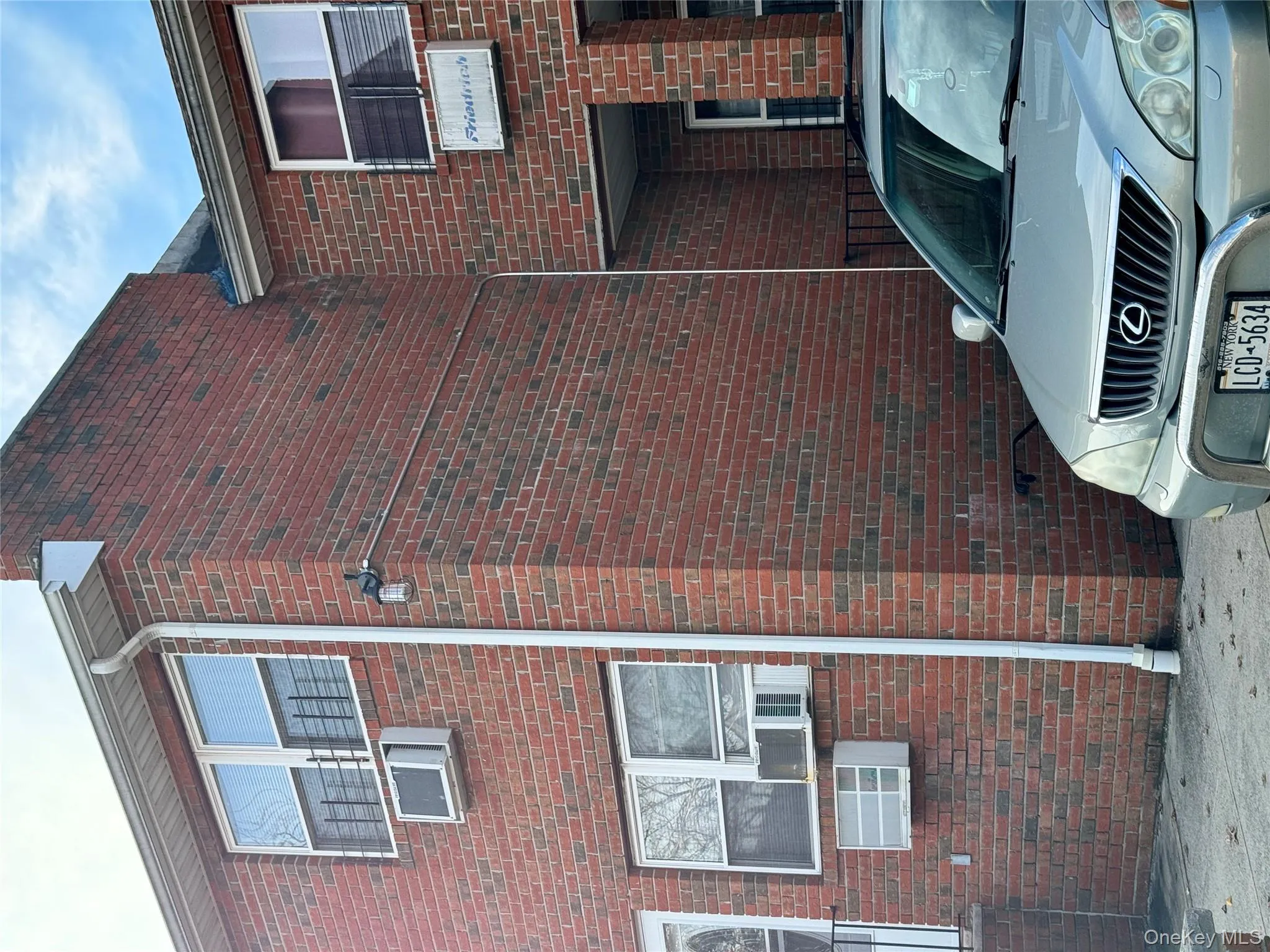 View of side of property featuring brick siding and cooling unit View of side of property featuring brick siding and cooling unit