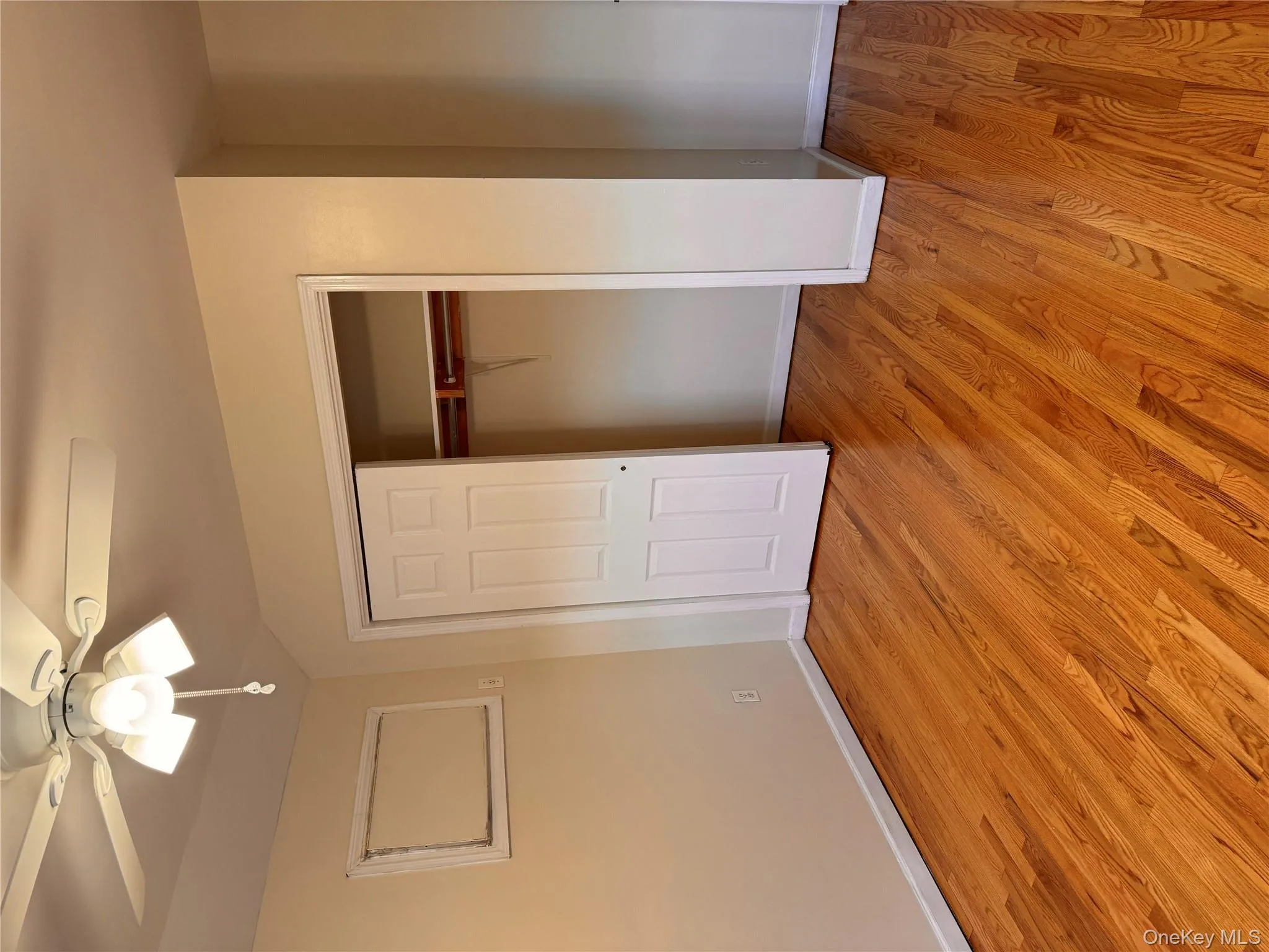 Unfurnished bedroom with a closet, light wood-style flooring, ceiling fan, and lofted ceiling Unfurnished bedroom with a closet, light wood-style flooring, ceiling fan, and lofted ceiling