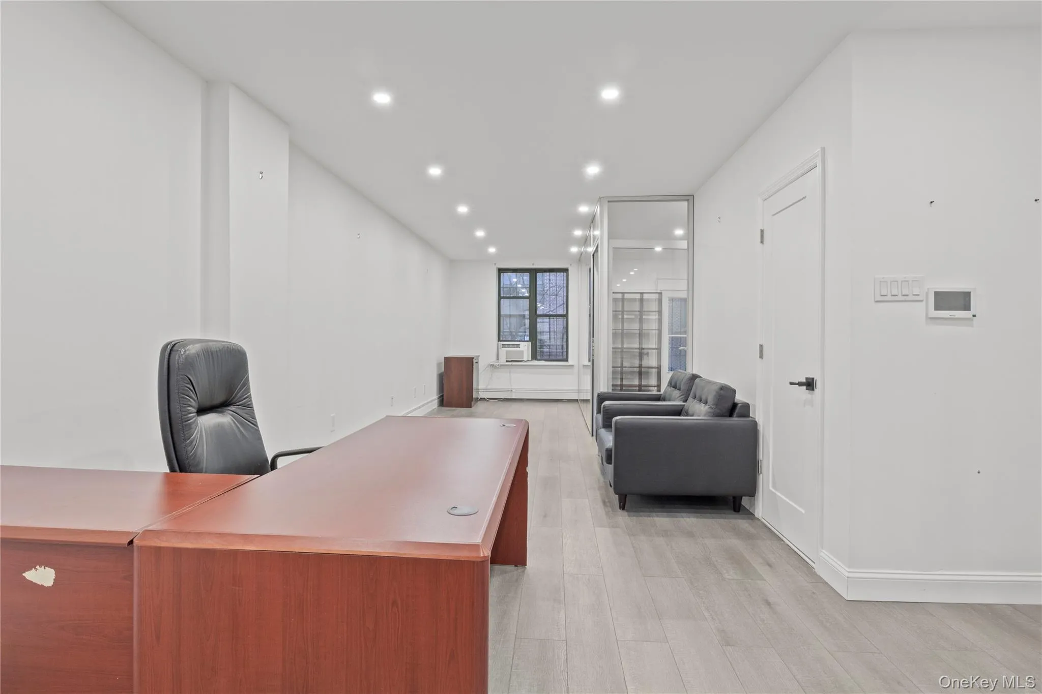 Office with recessed lighting and light wood-type flooring Office with recessed lighting and light wood-type flooring