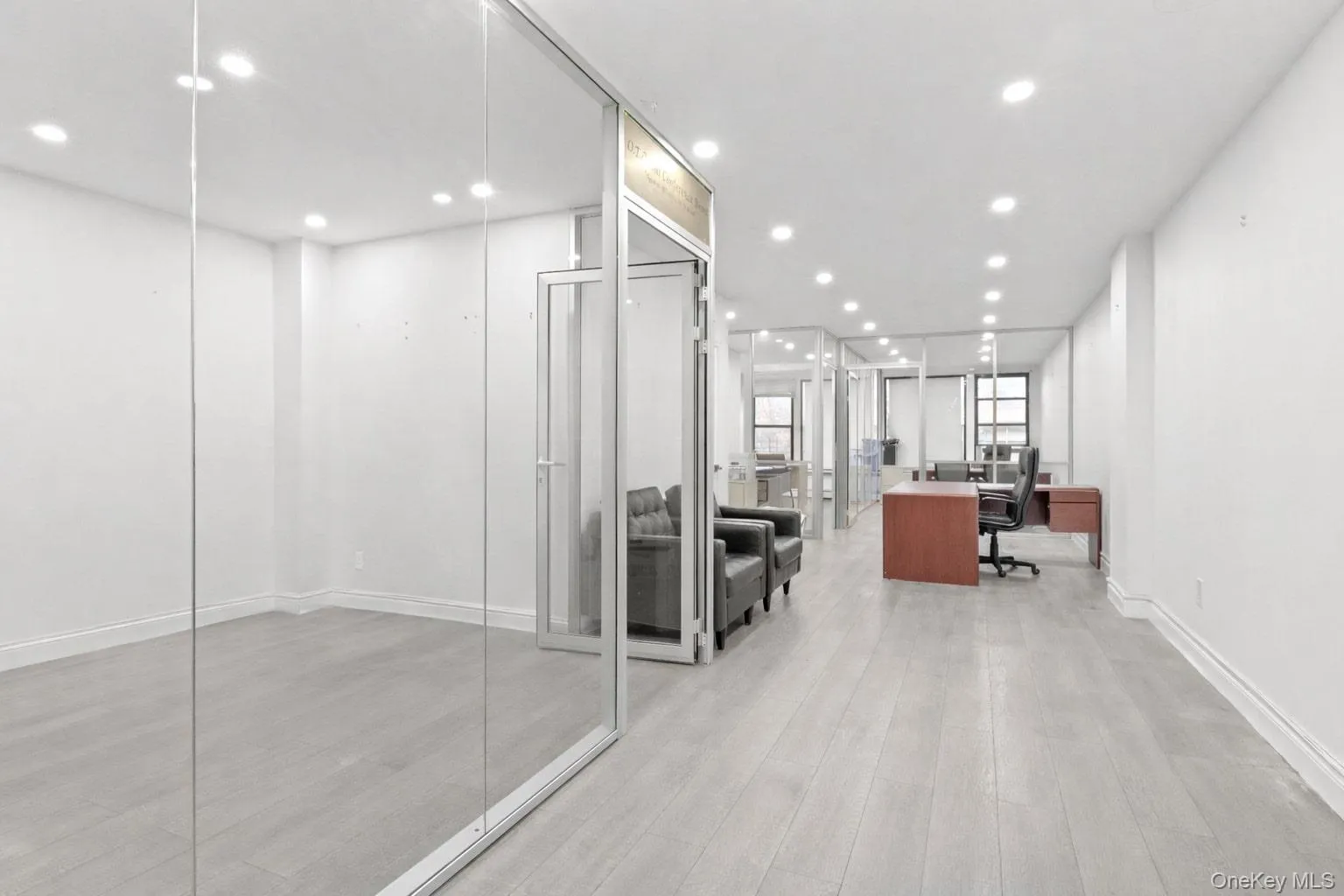 Office space with recessed lighting and light wood-type flooring Office space with recessed lighting and light wood-type flooring