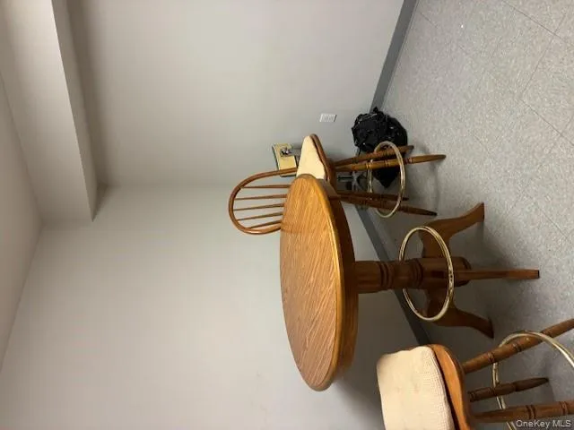 Dining space with light flooring and baseboards Dining space with light flooring and baseboards