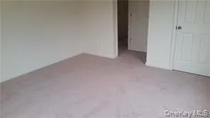 Unfurnished bedroom featuring a closet Unfurnished bedroom featuring a closet