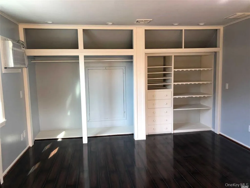 Closet featuring a wall mounted air conditioner Closet featuring a wall mounted air conditioner