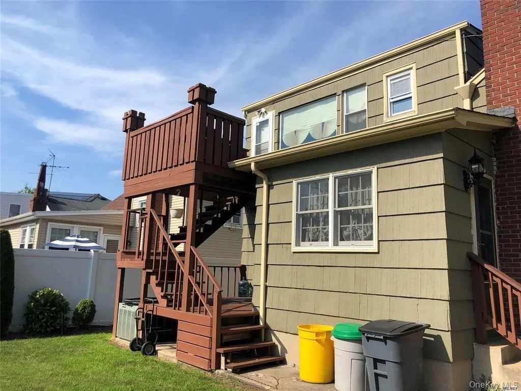 Back of property with stairway Back of property with stairway