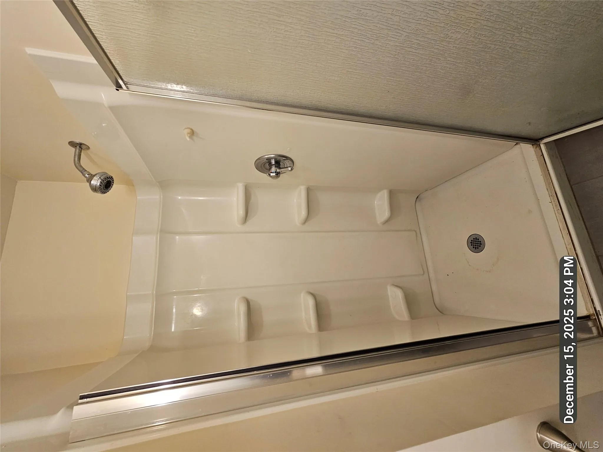 Bathroom featuring a shower stall Bathroom featuring a shower stall