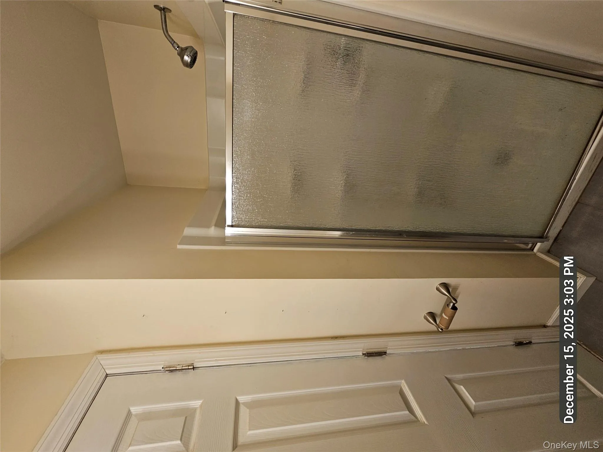 Bathroom featuring a shower stall Bathroom featuring a shower stall