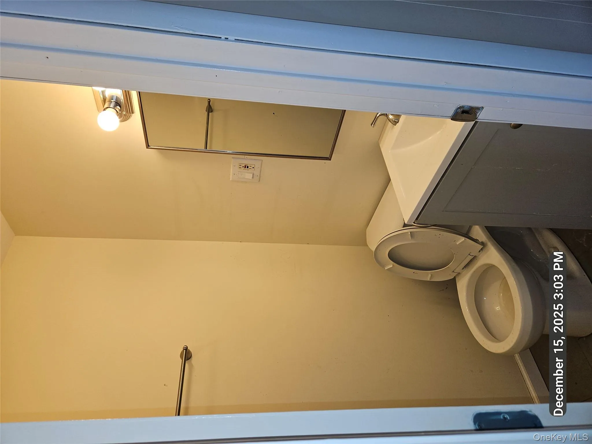 Half bathroom with vanity and toilet Half bathroom with vanity and toilet