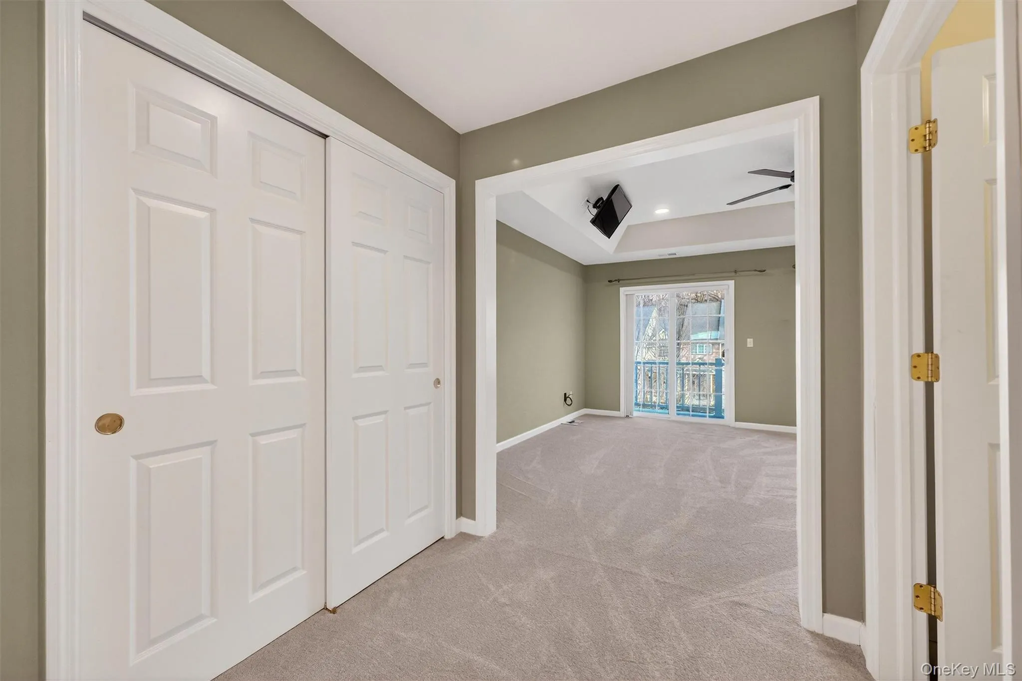 Unfurnished bedroom featuring light colored carpet, a closet, recessed lighting, and access to outside Unfurnished bedroom featuring light colored carpet, a closet, recessed lighting, and access to outside