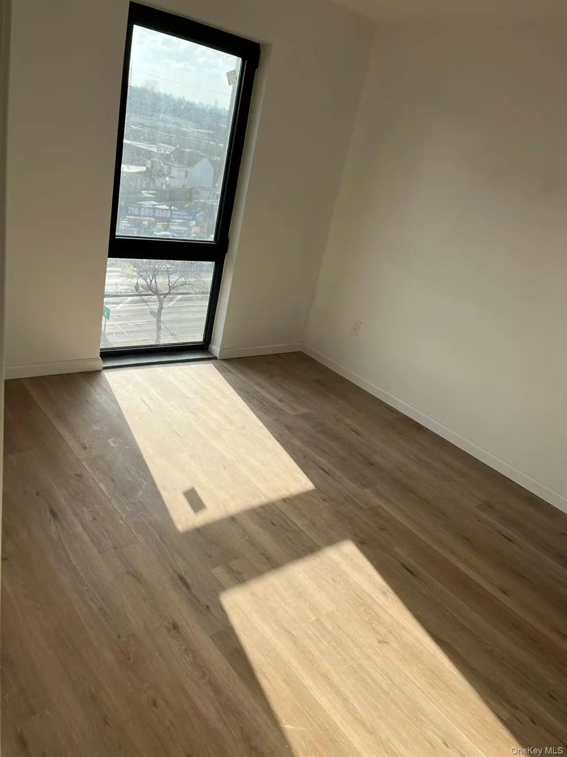 Unfurnished room with light wood-style flooring Unfurnished room with light wood-style flooring
