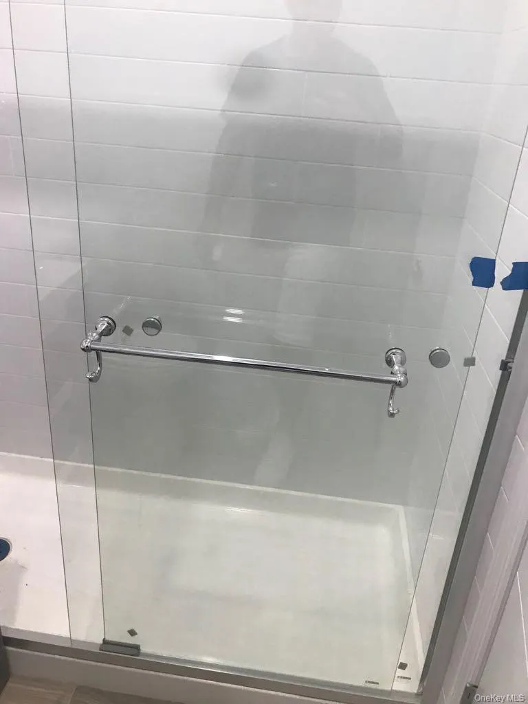 Full bathroom with a shower stall Full bathroom with a shower stall