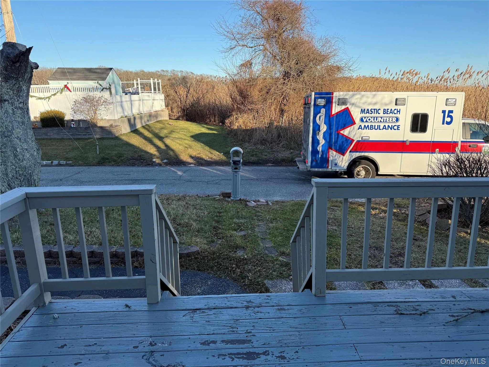 Deck featuring a lawn Deck featuring a lawn