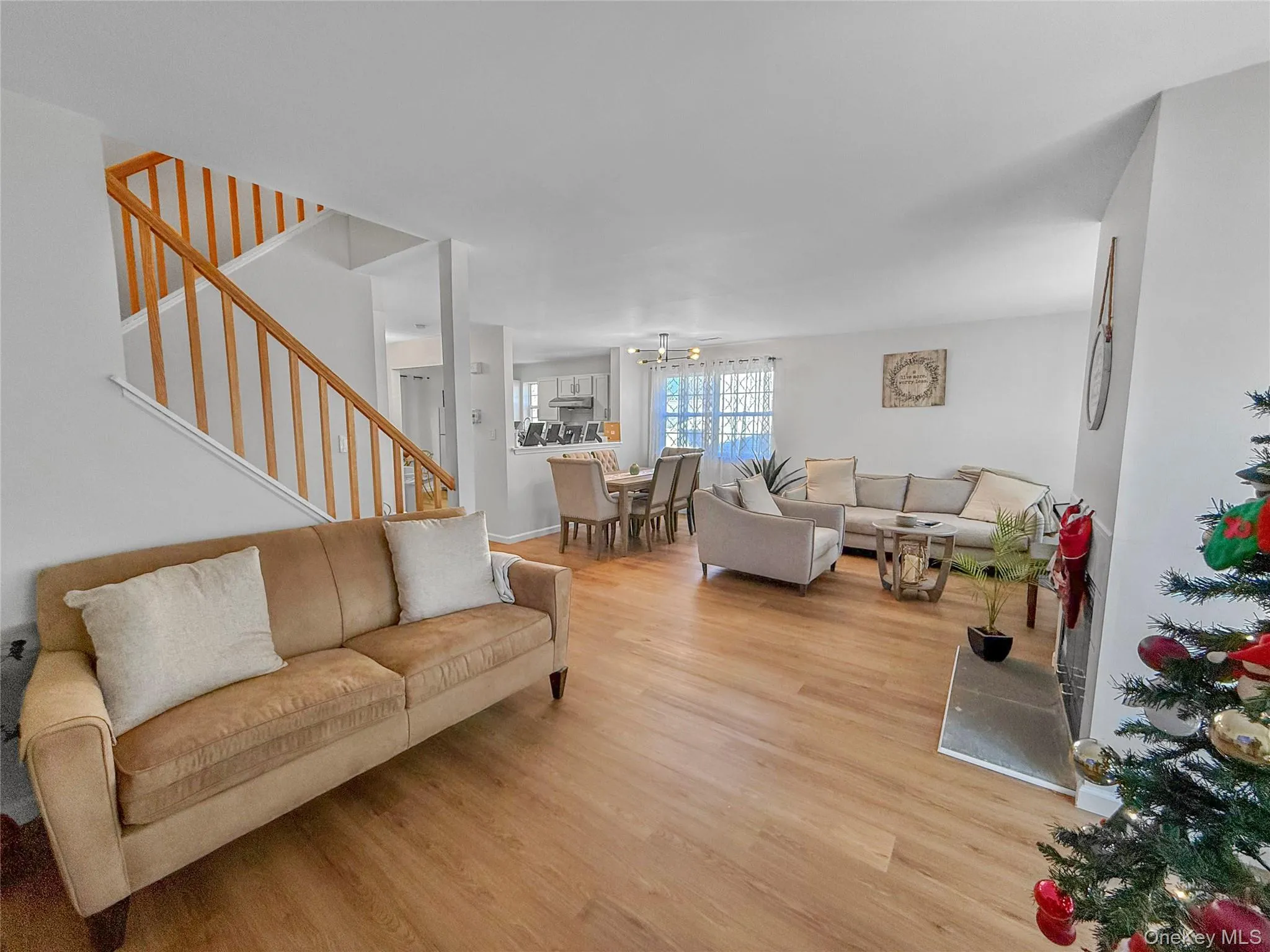 Living area with stairway and light wood finished floors Living area with stairway and light wood finished floors