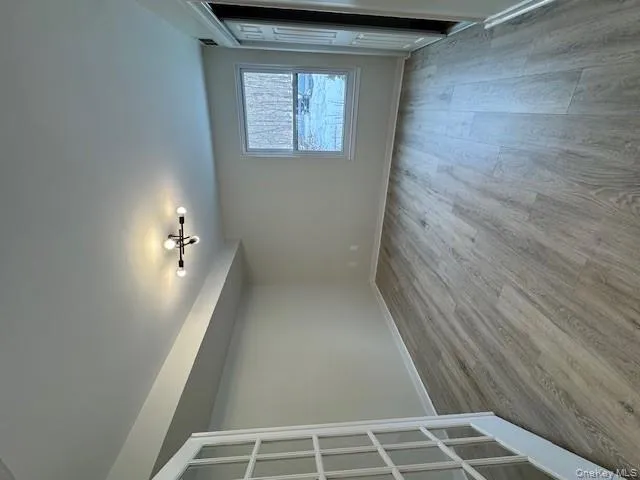 Spare room with light wood-style floors and baseboards Spare room with light wood-style floors and baseboards