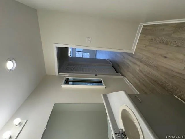 Bathroom featuring vanity, light wood-style floors, and recessed lighting Bathroom featuring vanity, light wood-style floors, and recessed lighting