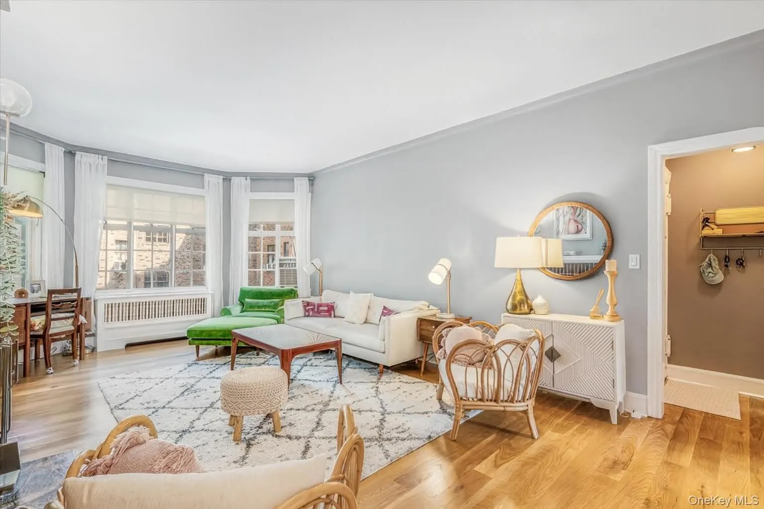 Living room featuring radiator and wood finished floors Living room featuring radiator and wood finished floors