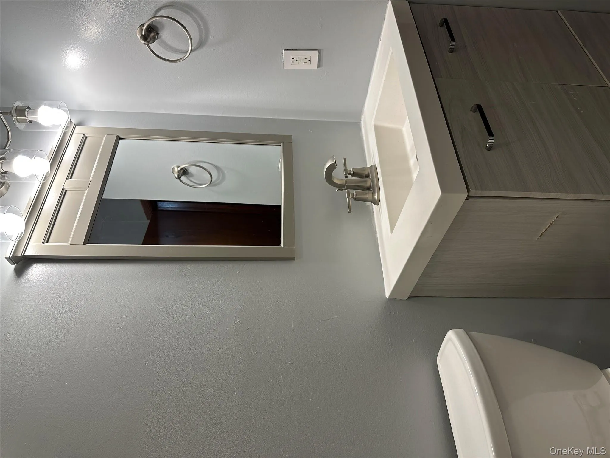 Bathroom featuring vanity and toilet Bathroom featuring vanity and toilet