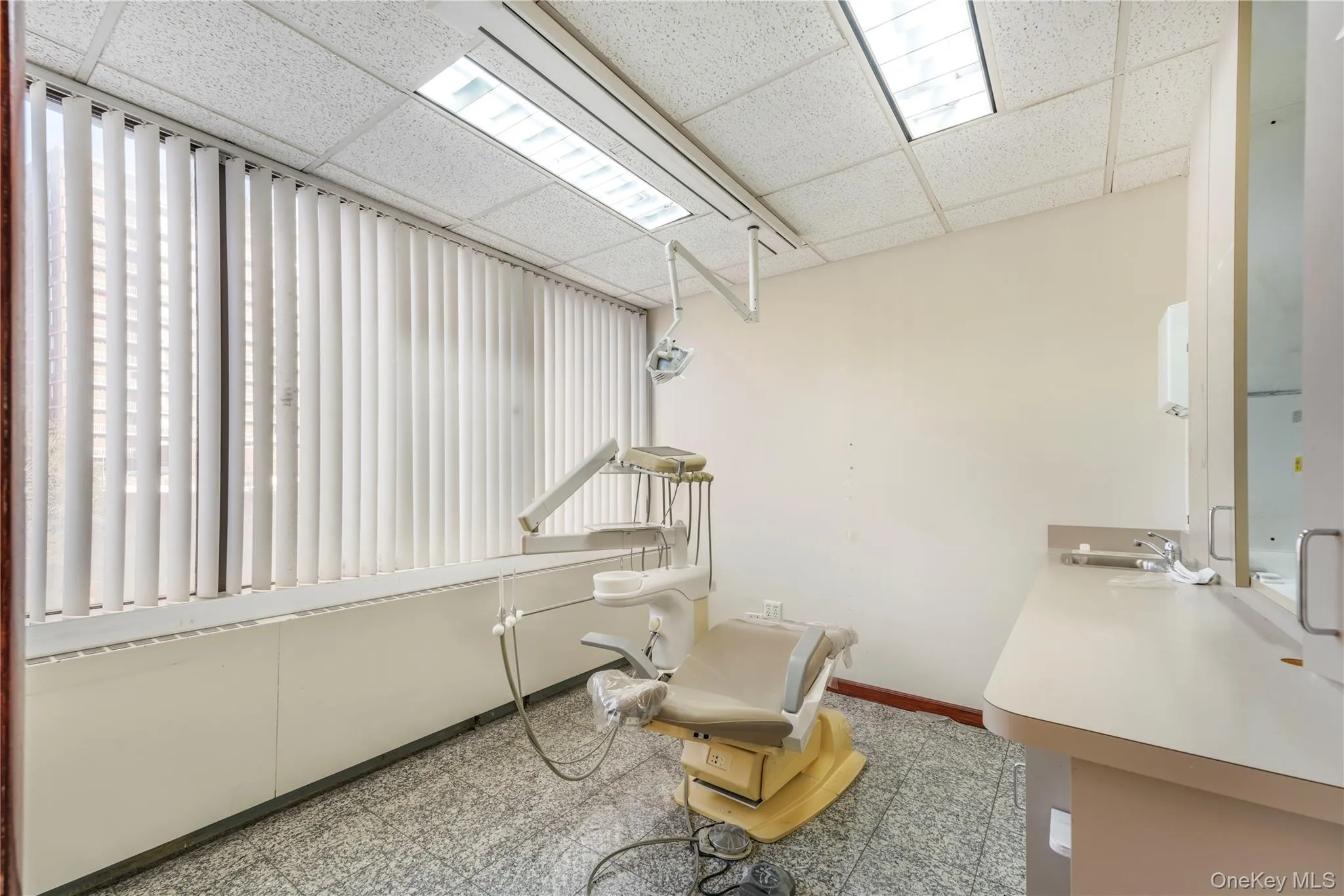 Living area with a paneled ceiling Living area with a paneled ceiling