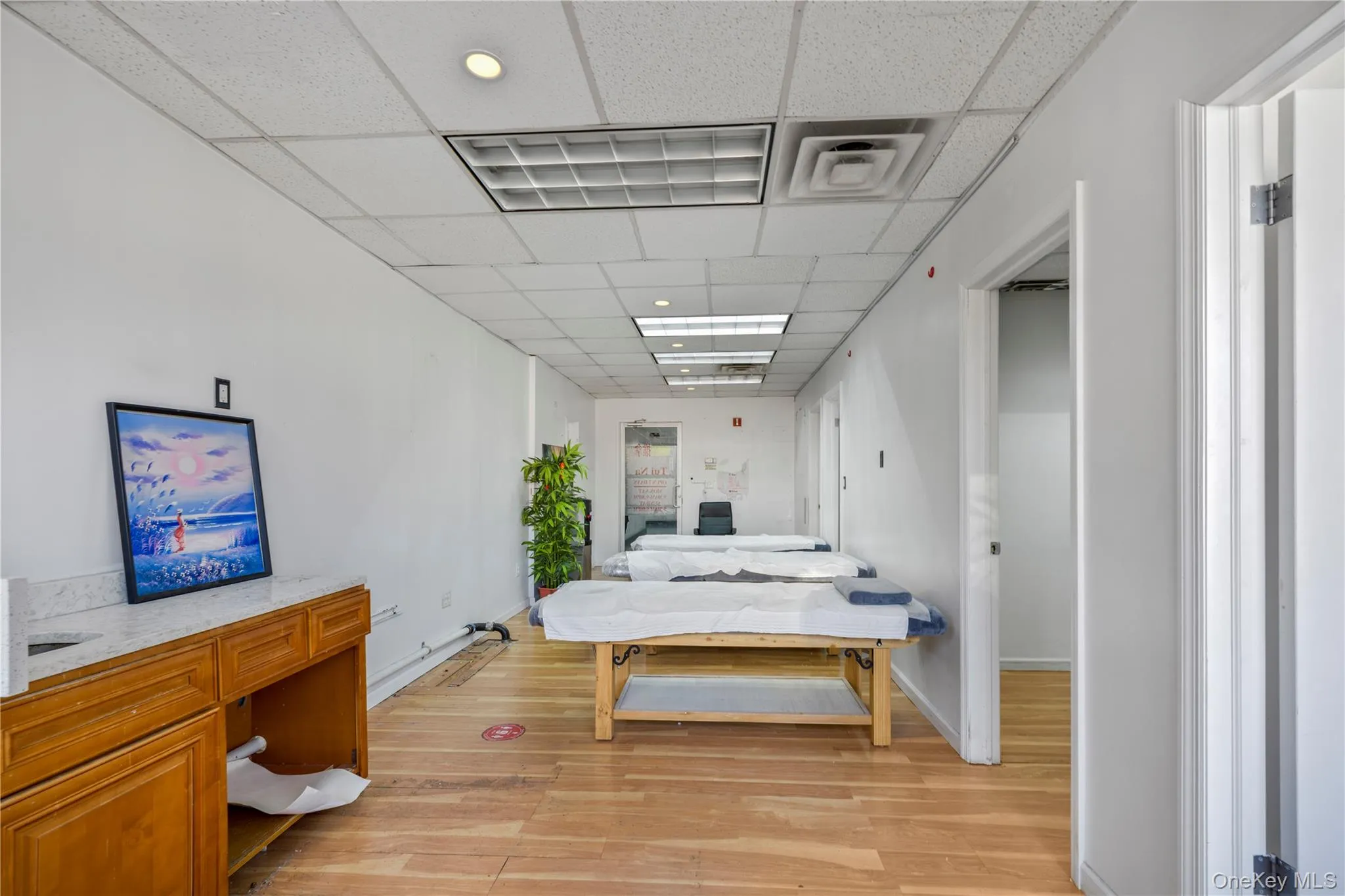 Bedroom with light wood-type flooring and baseboards Bedroom with light wood-type flooring and baseboards