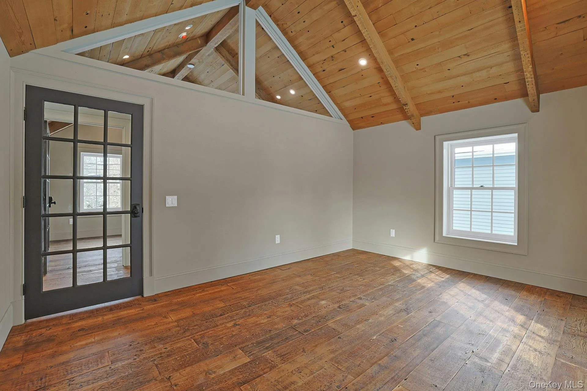 Spare room featuring wood-type flooring, wooden ceiling, and recessed lighting Spare room featuring wood-type flooring, wooden ceiling, and recessed lighting
