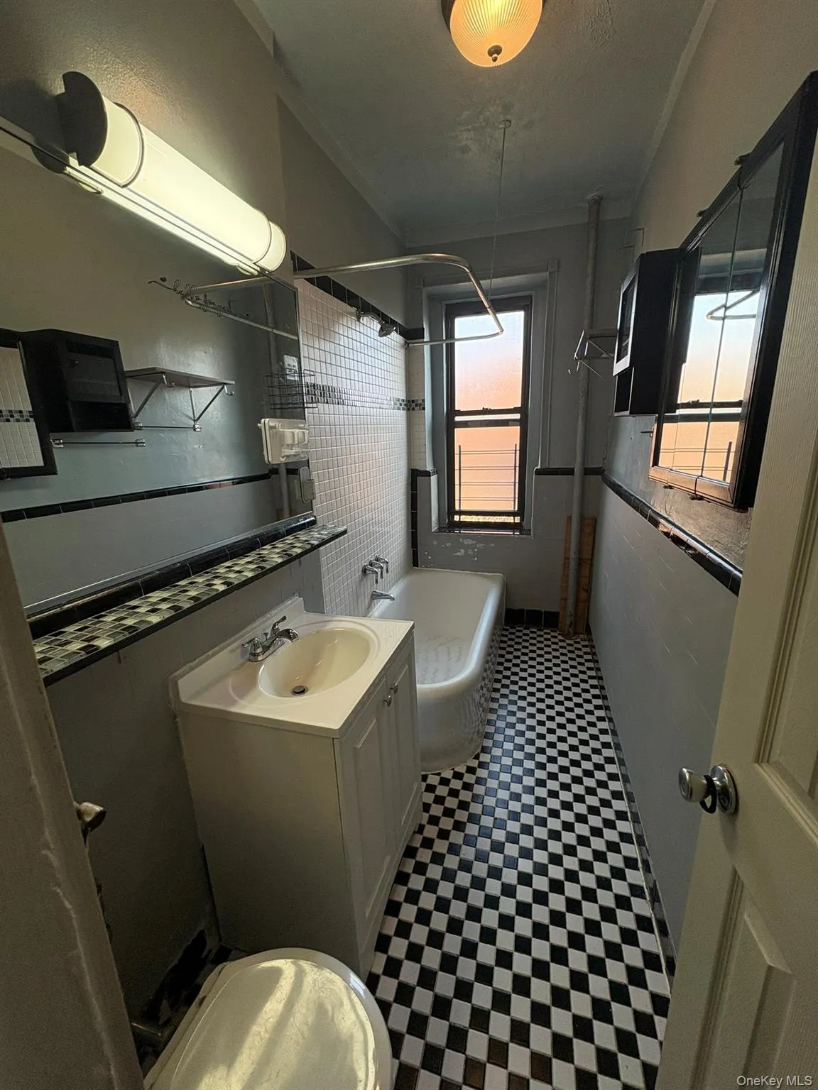 Full bath featuring vanity, light flooring, and shower / tub combination Full bath featuring vanity, light flooring, and shower / tub combination