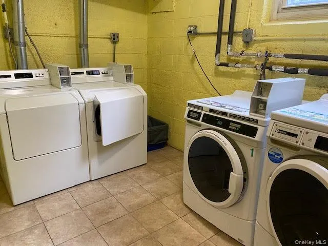 Community laundry room with independent washer and dryer Community laundry room with independent washer and dryer