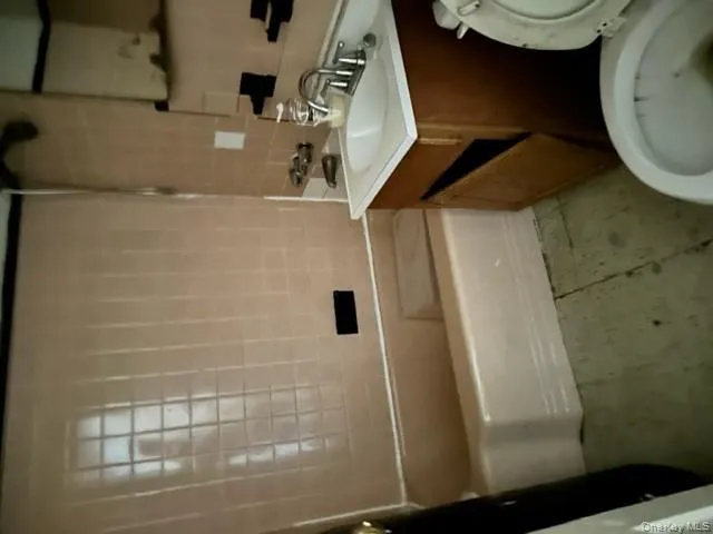 Bathroom with vanity and light tile patterned floors Bathroom with vanity and light tile patterned floors