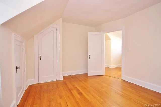 Additional living space featuring light wood finished floors and baseboards Additional living space featuring light wood finished floors and baseboards