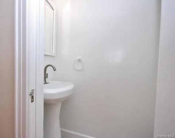 Bathroom featuring baseboards Bathroom featuring baseboards