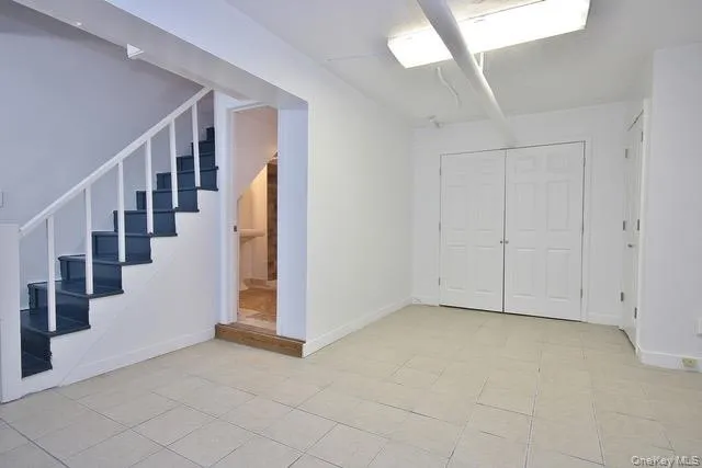 Basement featuring stairway Basement featuring stairway