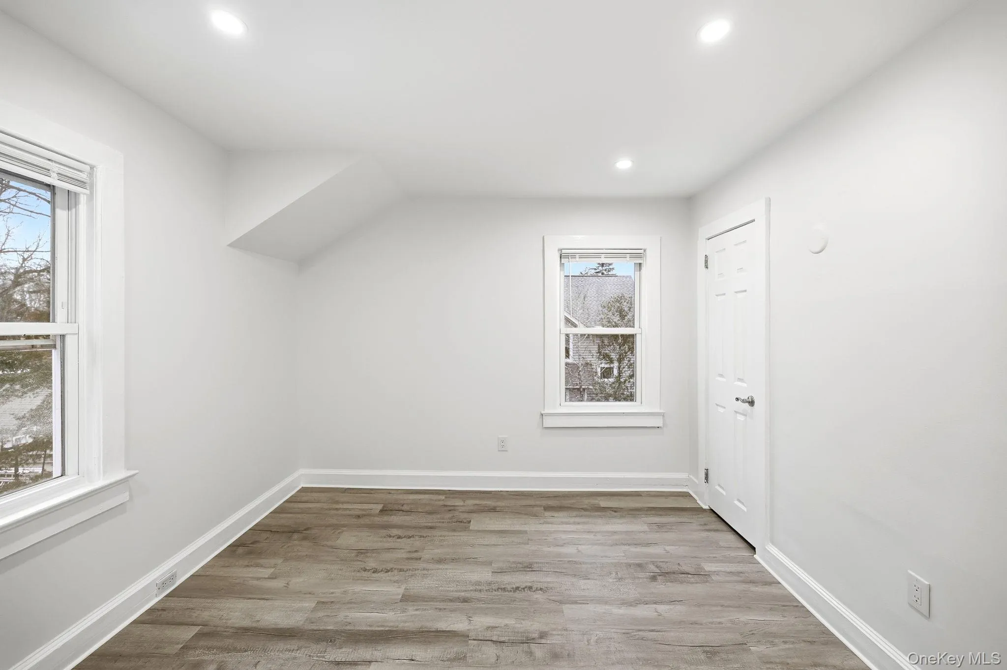 Bonus room featuring light wood-style floors and recessed lighting Bonus room featuring light wood-style floors and recessed lighting