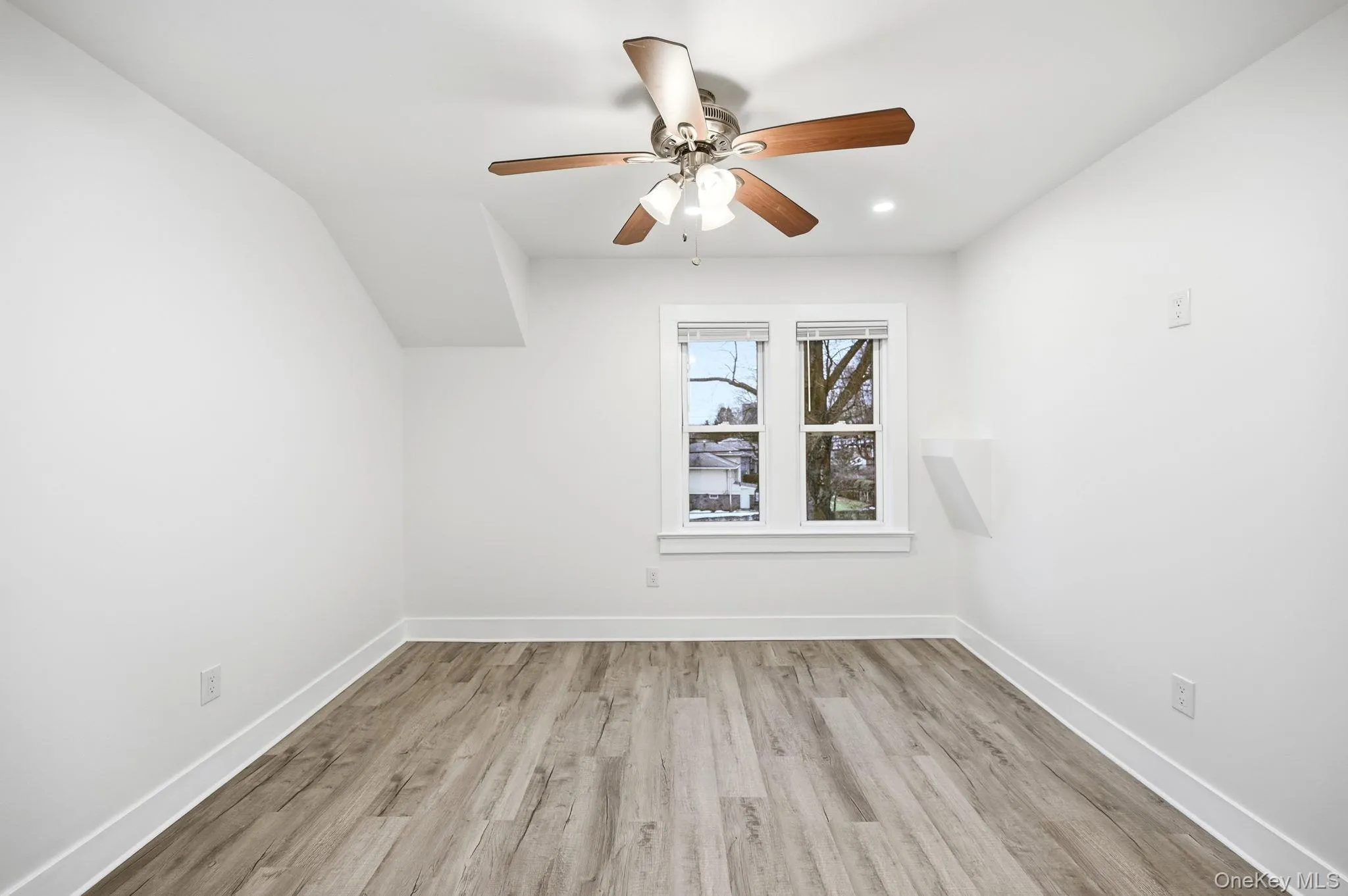 Unfurnished room featuring light wood finished floors, ceiling fan, and recessed lighting Unfurnished room featuring light wood finished floors, ceiling fan, and recessed lighting