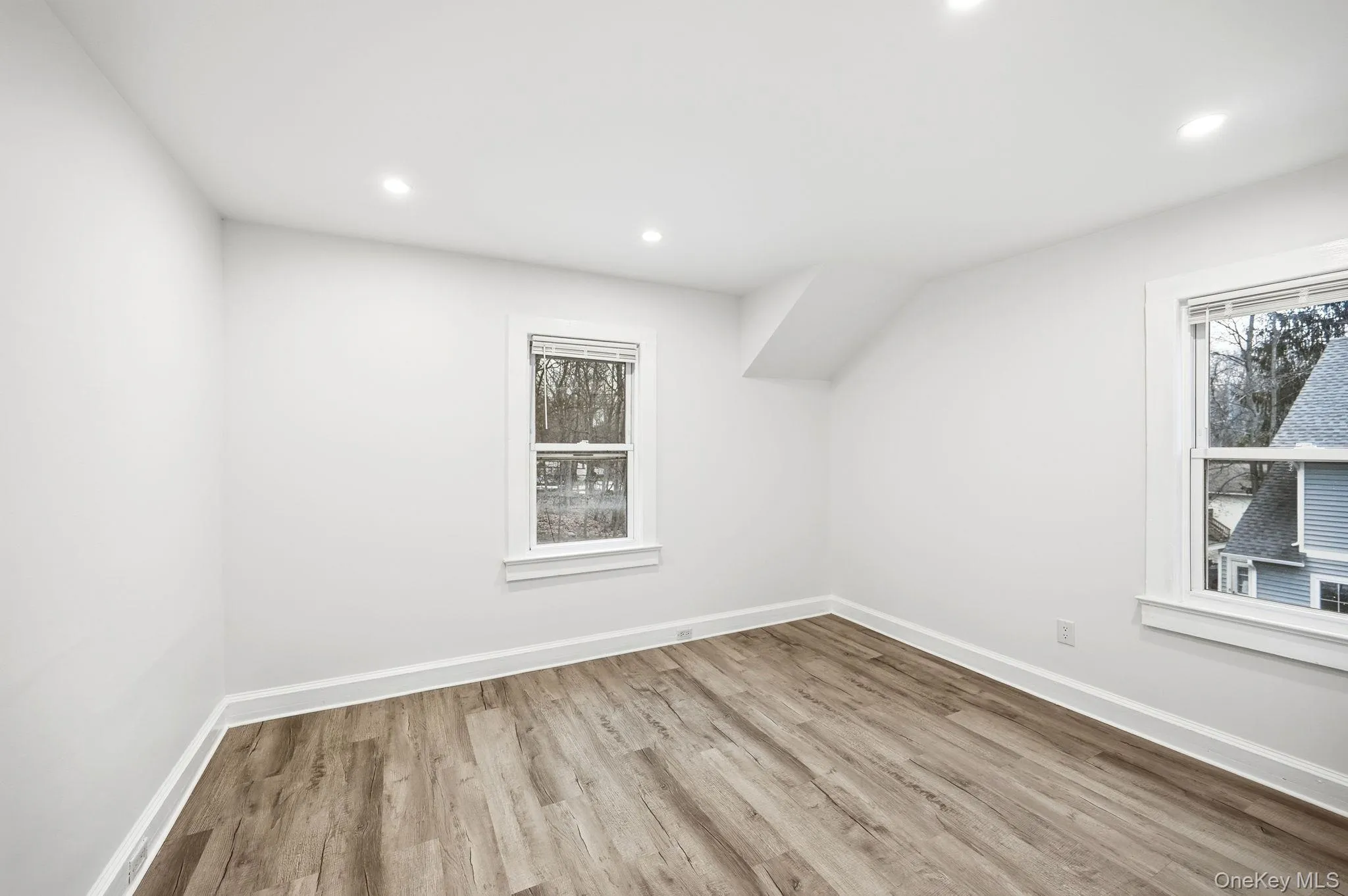 Additional living space with light wood-style floors, recessed lighting, and healthy amount of natural light Additional living space with light wood-style floors, recessed lighting, and healthy amount of natural light