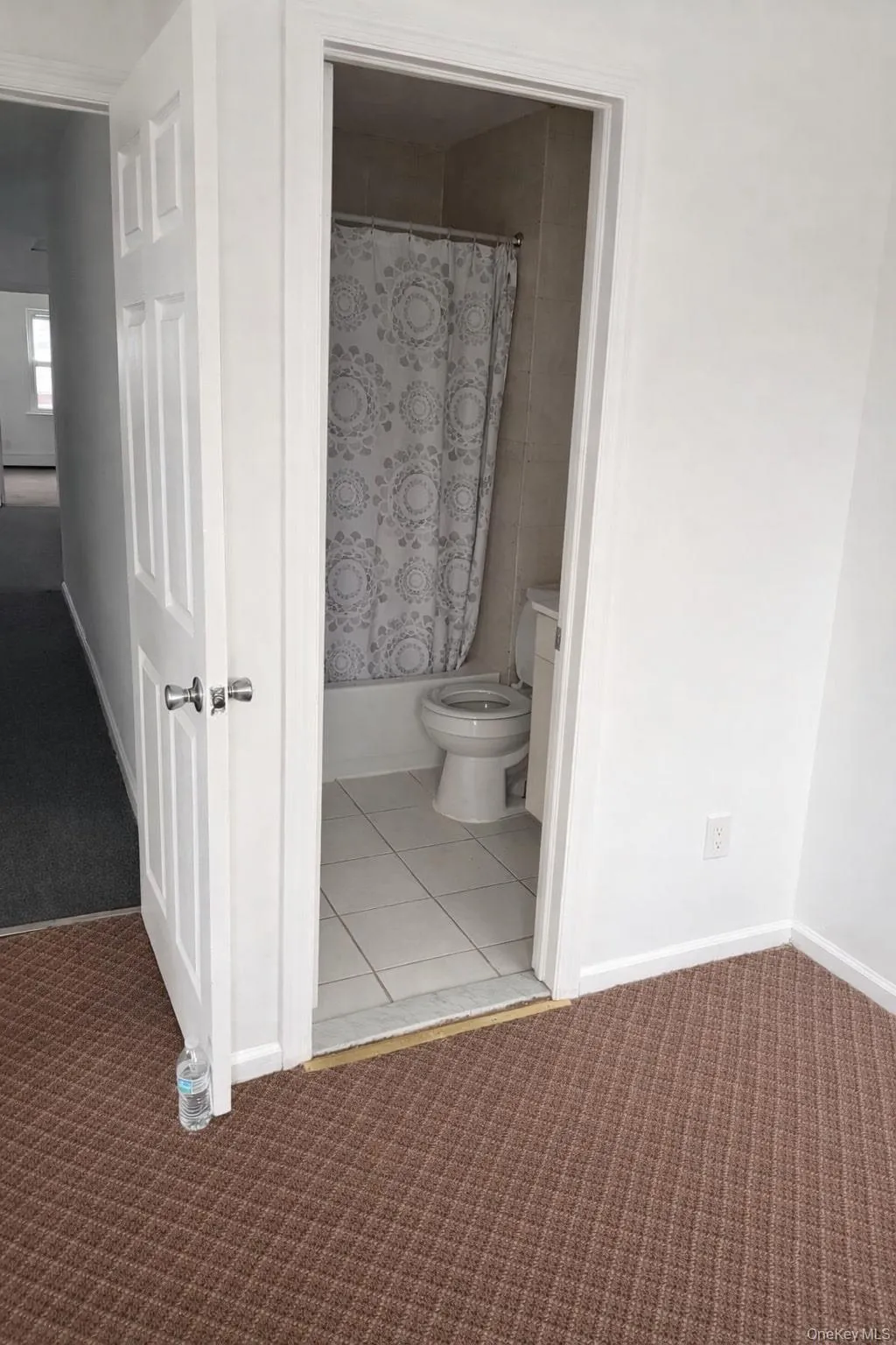 Full bathroom with light carpet, shower / tub combo, and vanity Full bathroom with light carpet, shower / tub combo, and vanity