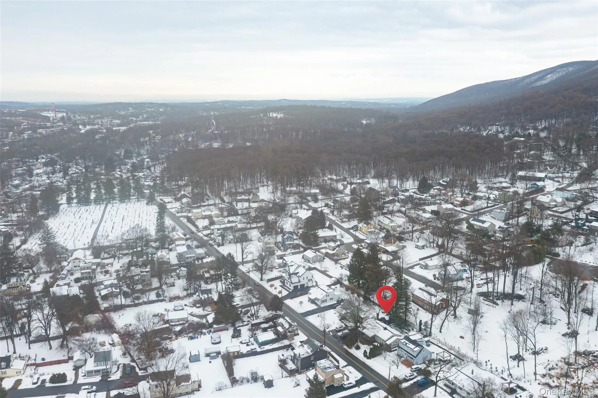 Snowy aerial view with a mountain view Snowy aerial view with a mountain view