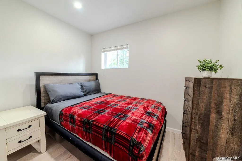 Bedroom with light wood finished floors Bedroom with light wood finished floors