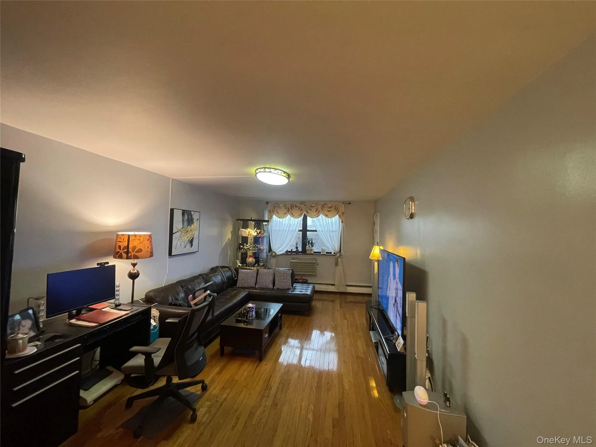 Home office with hardwood / wood-style floors Home office with hardwood / wood-style floors