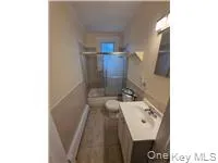 Full bathroom featuring a shower stall and vanity Full bathroom featuring a shower stall and vanity
