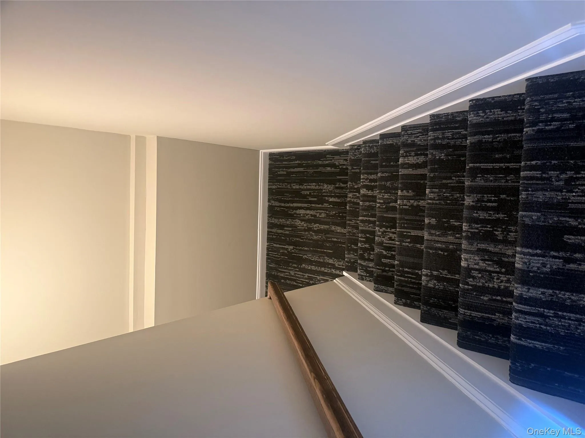 Stairway with baseboards and carpet Stairway with baseboards and carpet