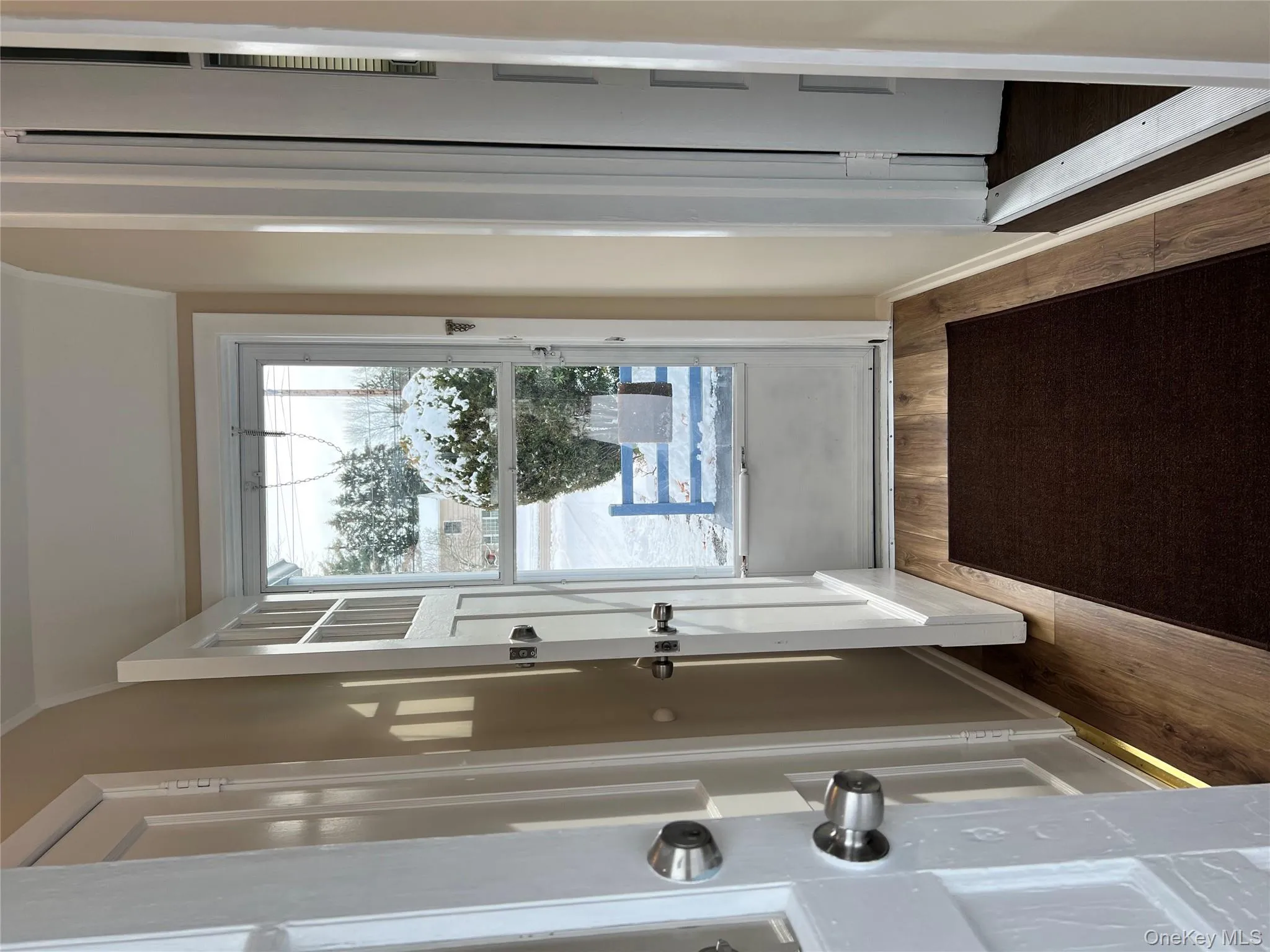 Doorway featuring wood finished floors Doorway featuring wood finished floors