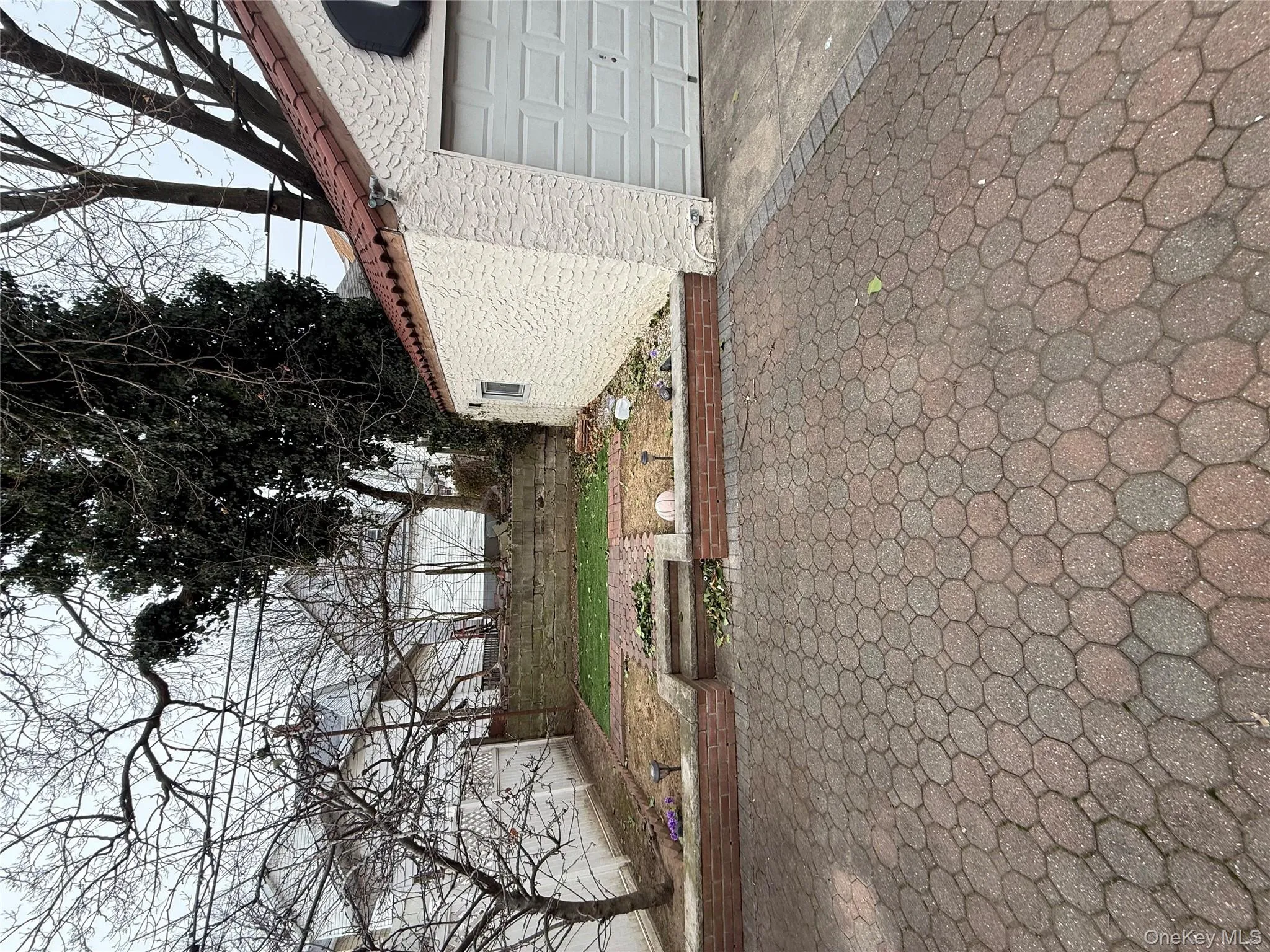 View of property exterior with stucco siding and a tile roof View of property exterior with stucco siding and a tile roof