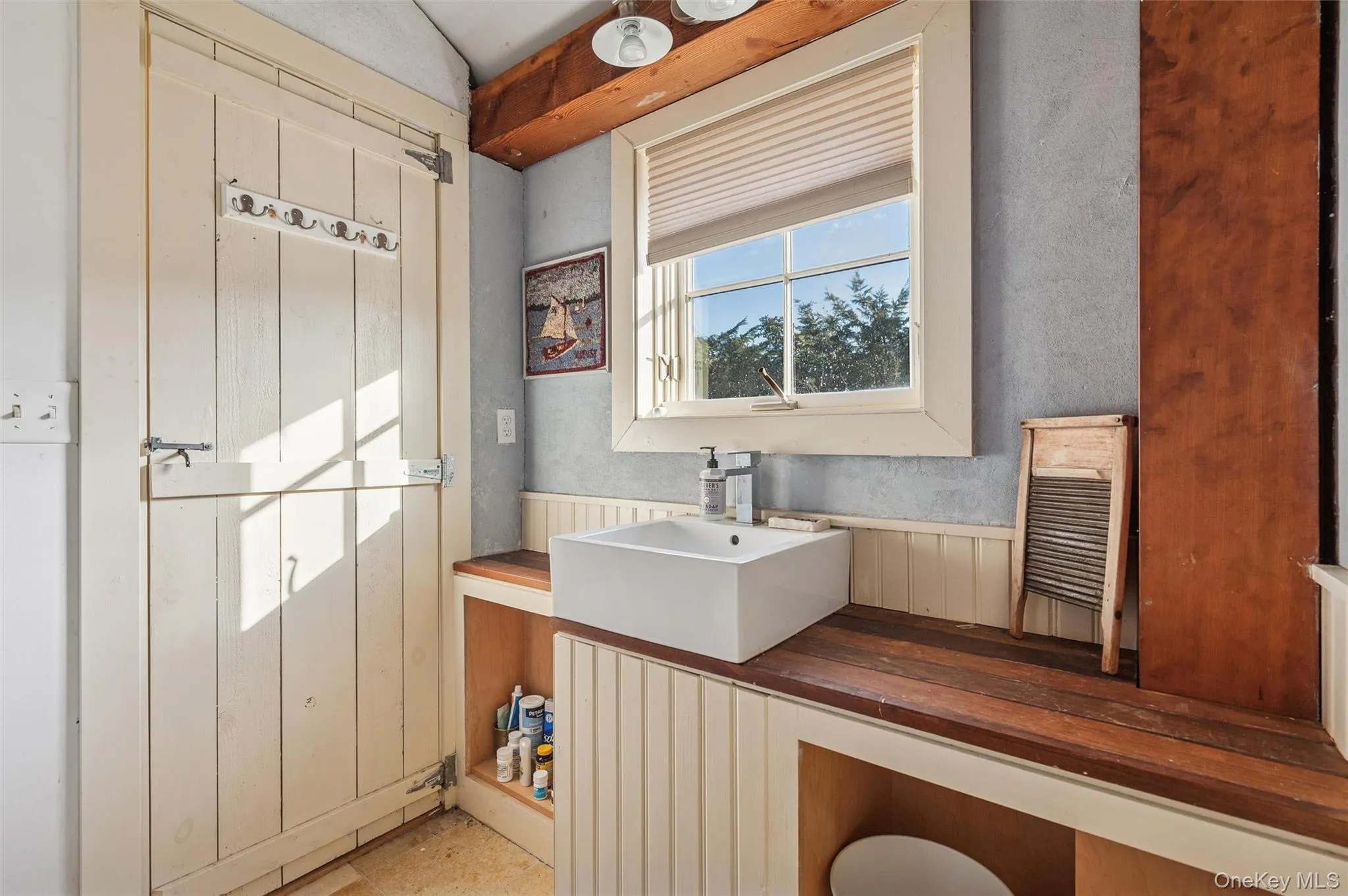 Bathroom with vanity and wainscoting Bathroom with vanity and wainscoting