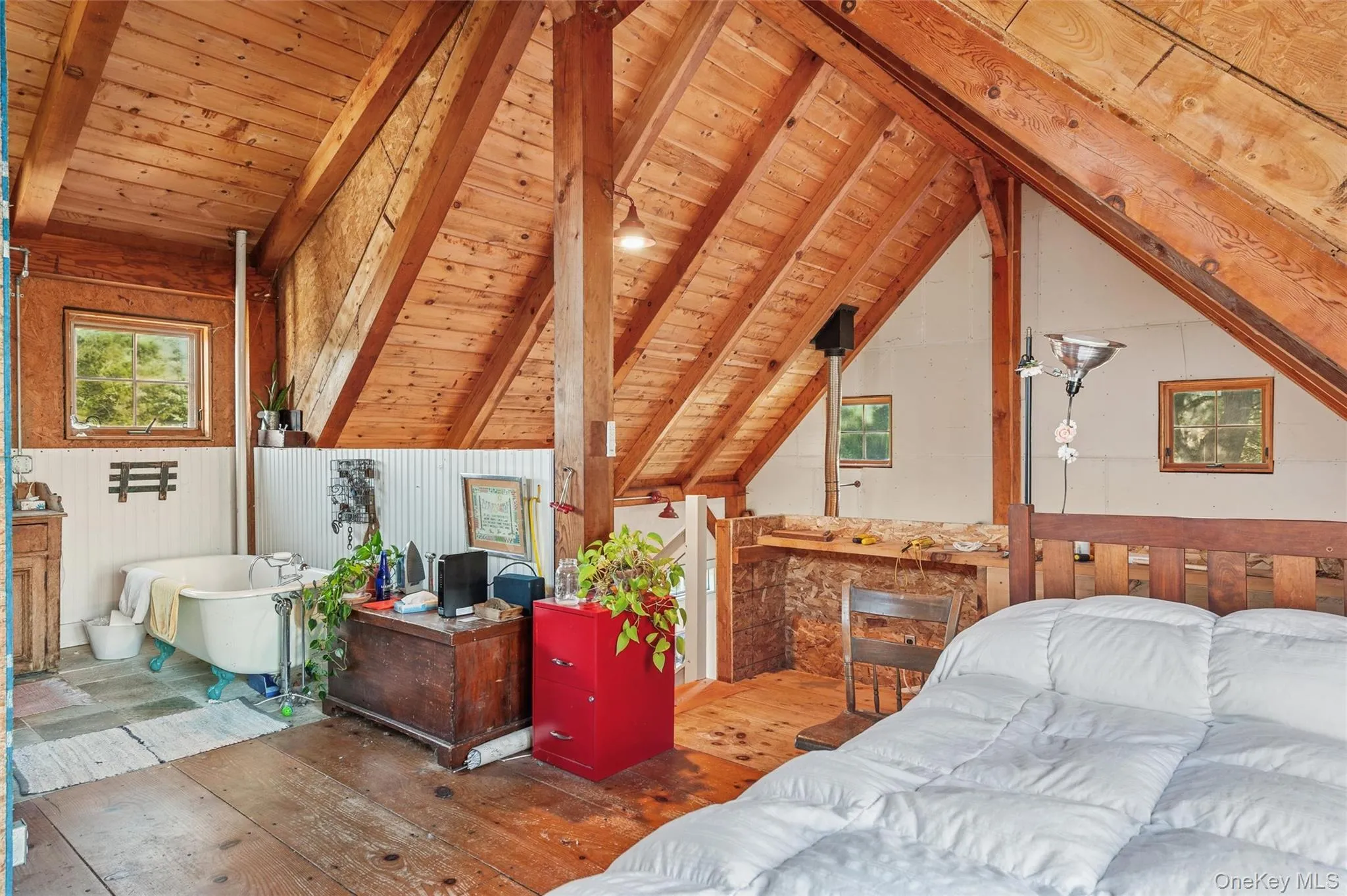 Bedroom featuring hardwood / wood-style flooring, wooden ceiling, and wooden walls Bedroom featuring hardwood / wood-style flooring, wooden ceiling, and wooden walls