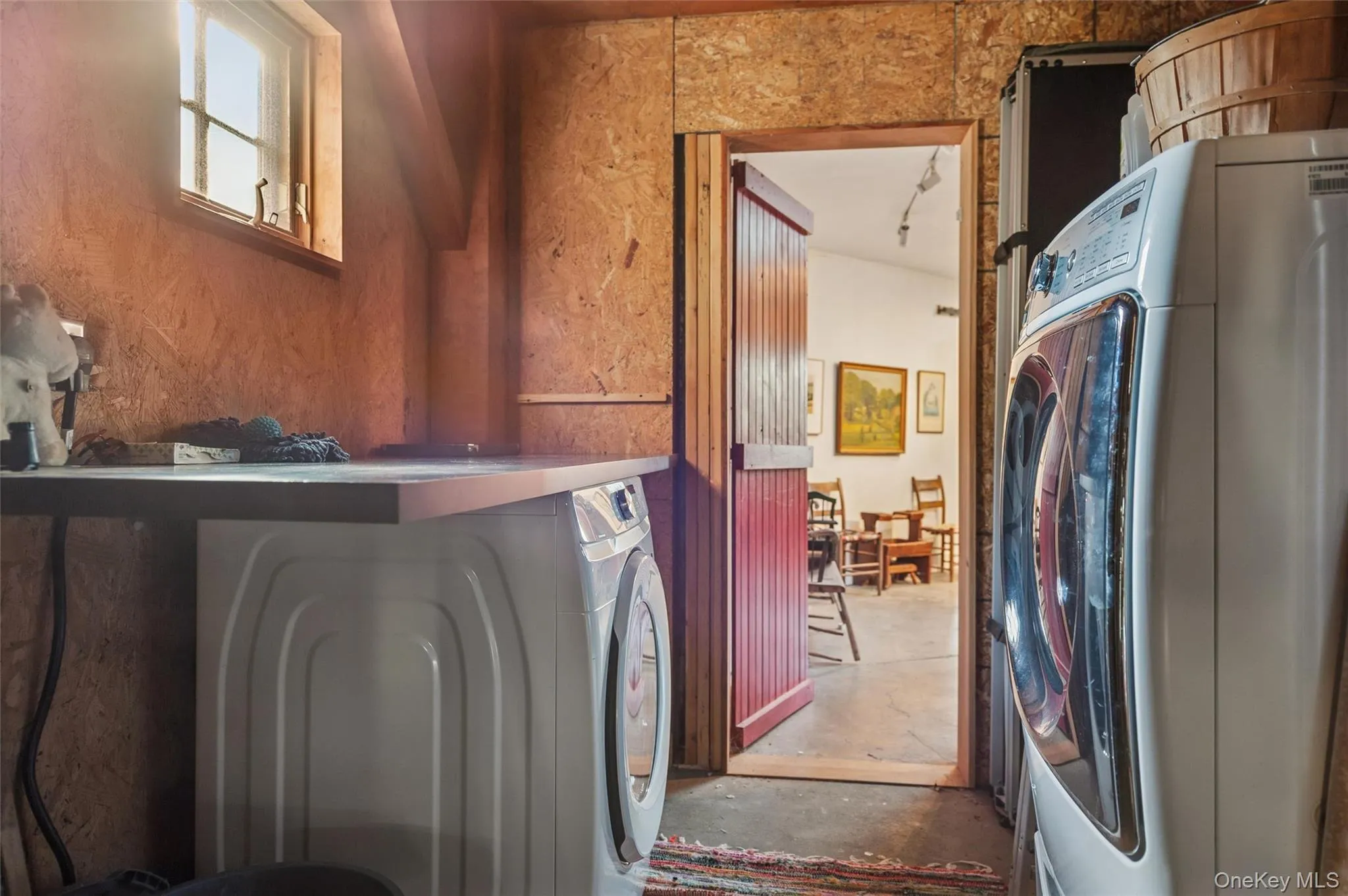 Laundry area with concrete flooring Laundry area with concrete flooring