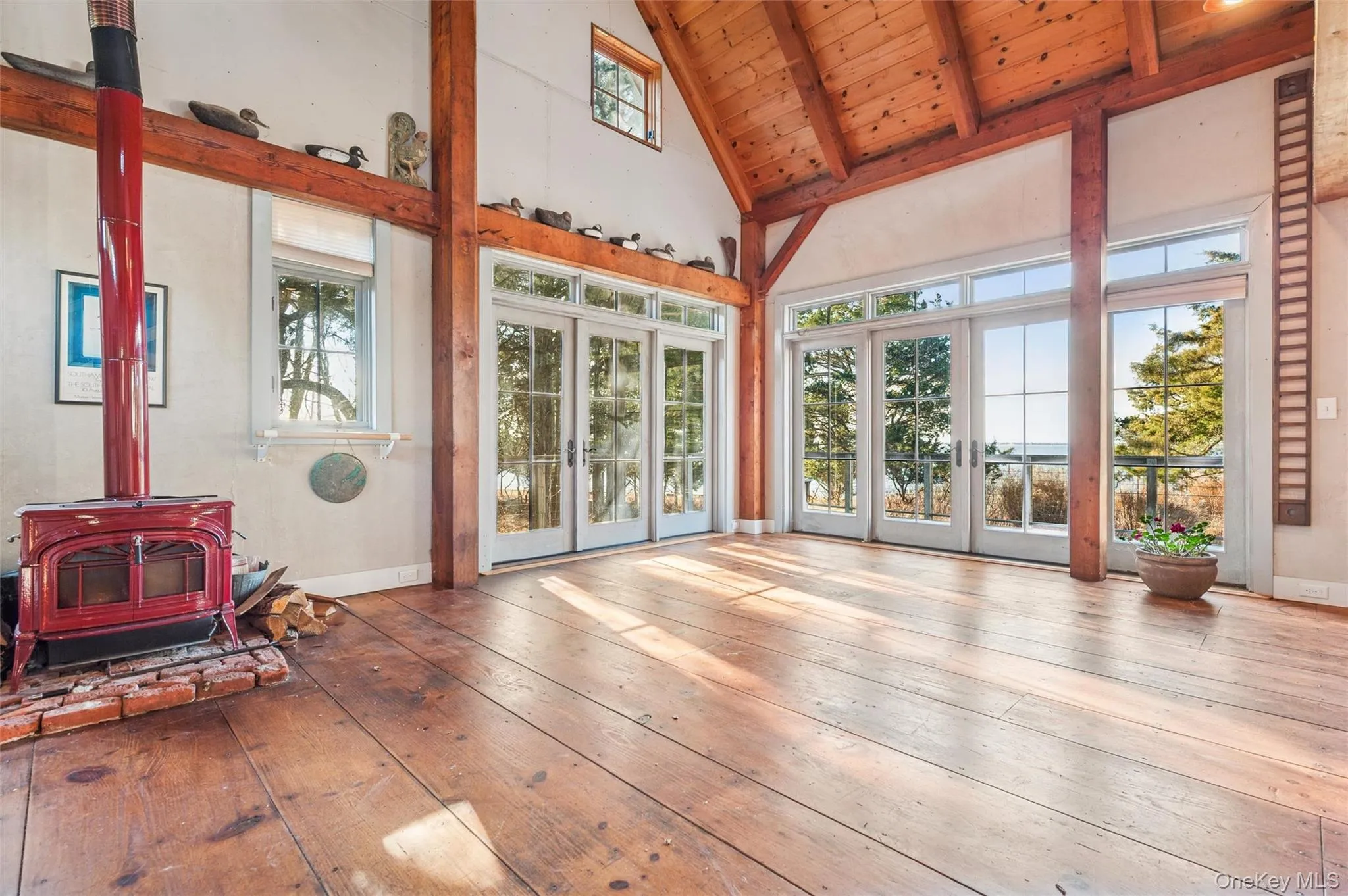 Sunroom / solarium with a wood stove and healthy amount of natural light Sunroom / solarium with a wood stove and healthy amount of natural light
